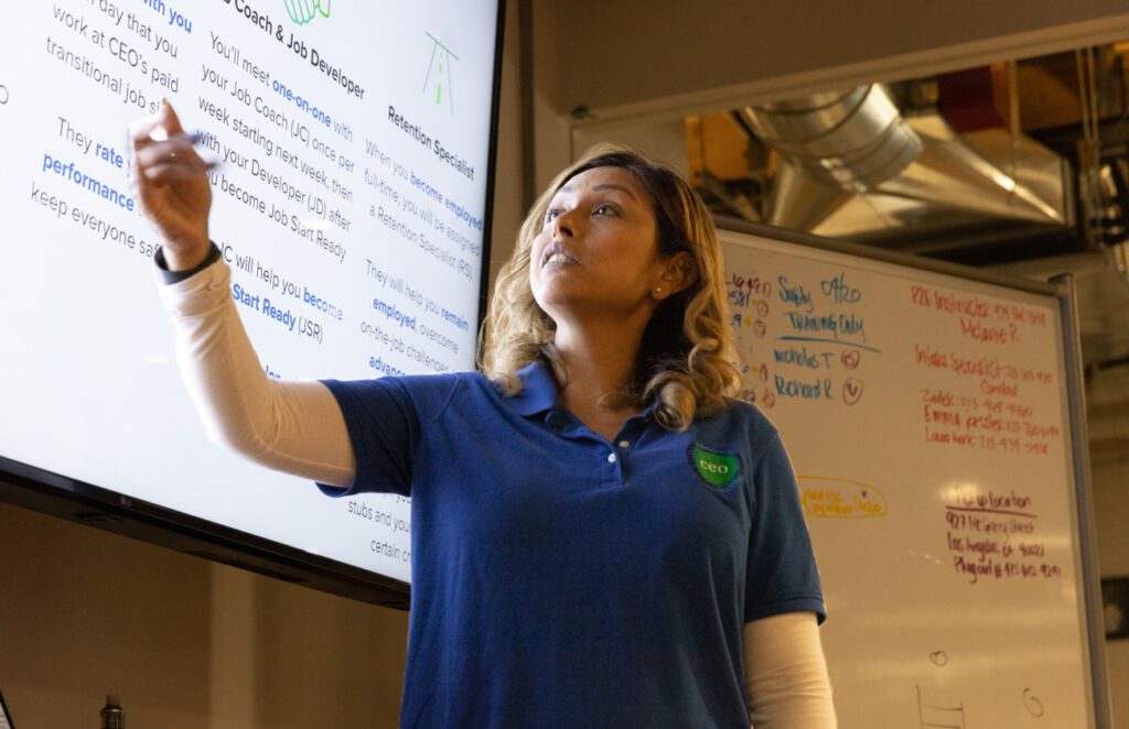 A woman presenting a powerpoint