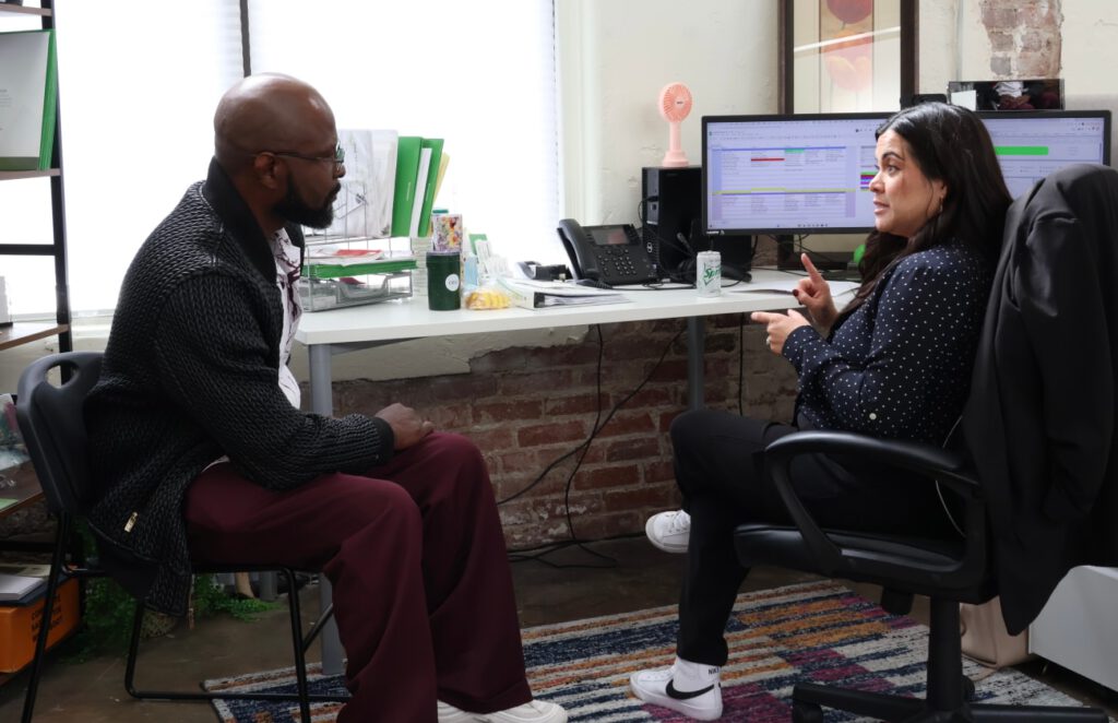 Two people discussing strategy in an office
